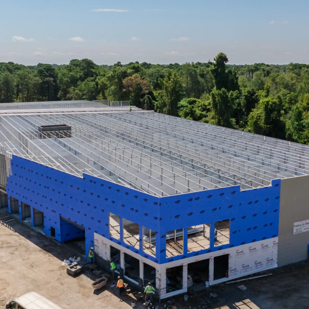 BuiltRite employees working on a multi-level storage building with walls installed.