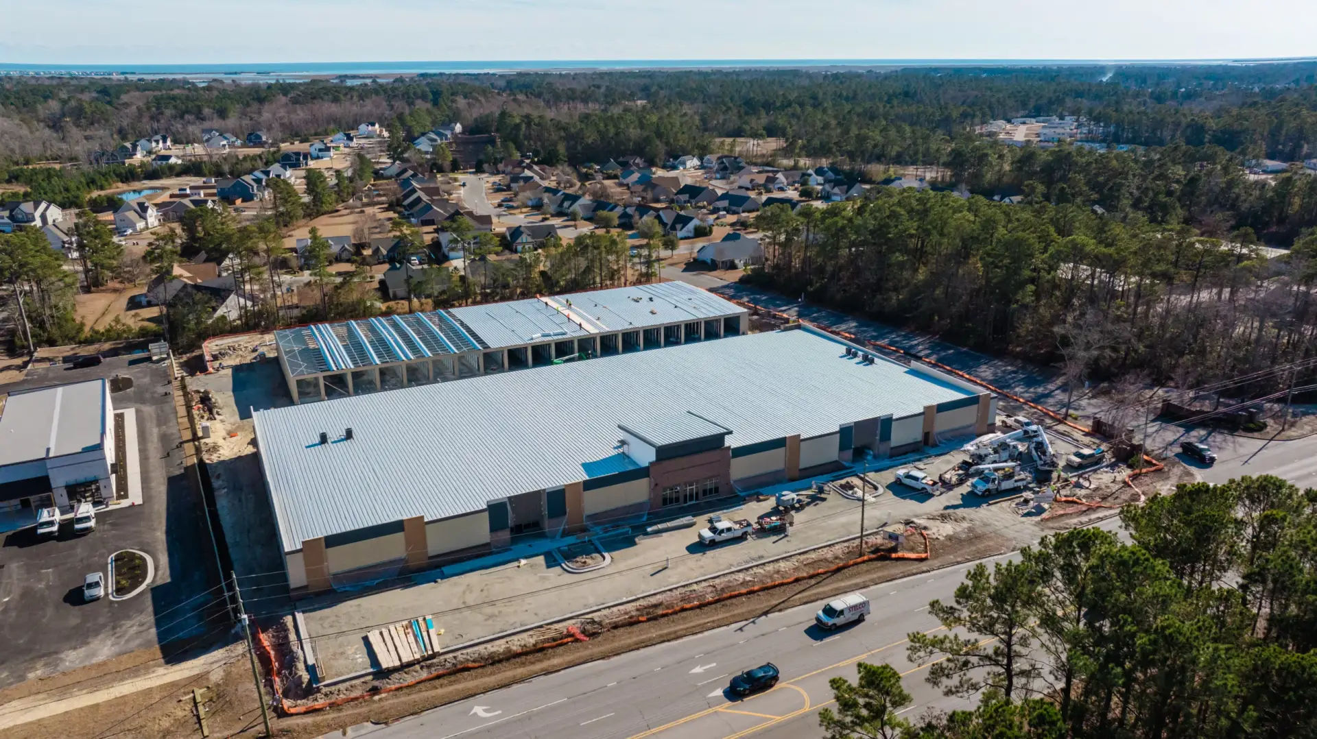 Large single-story storage building with parking lot.