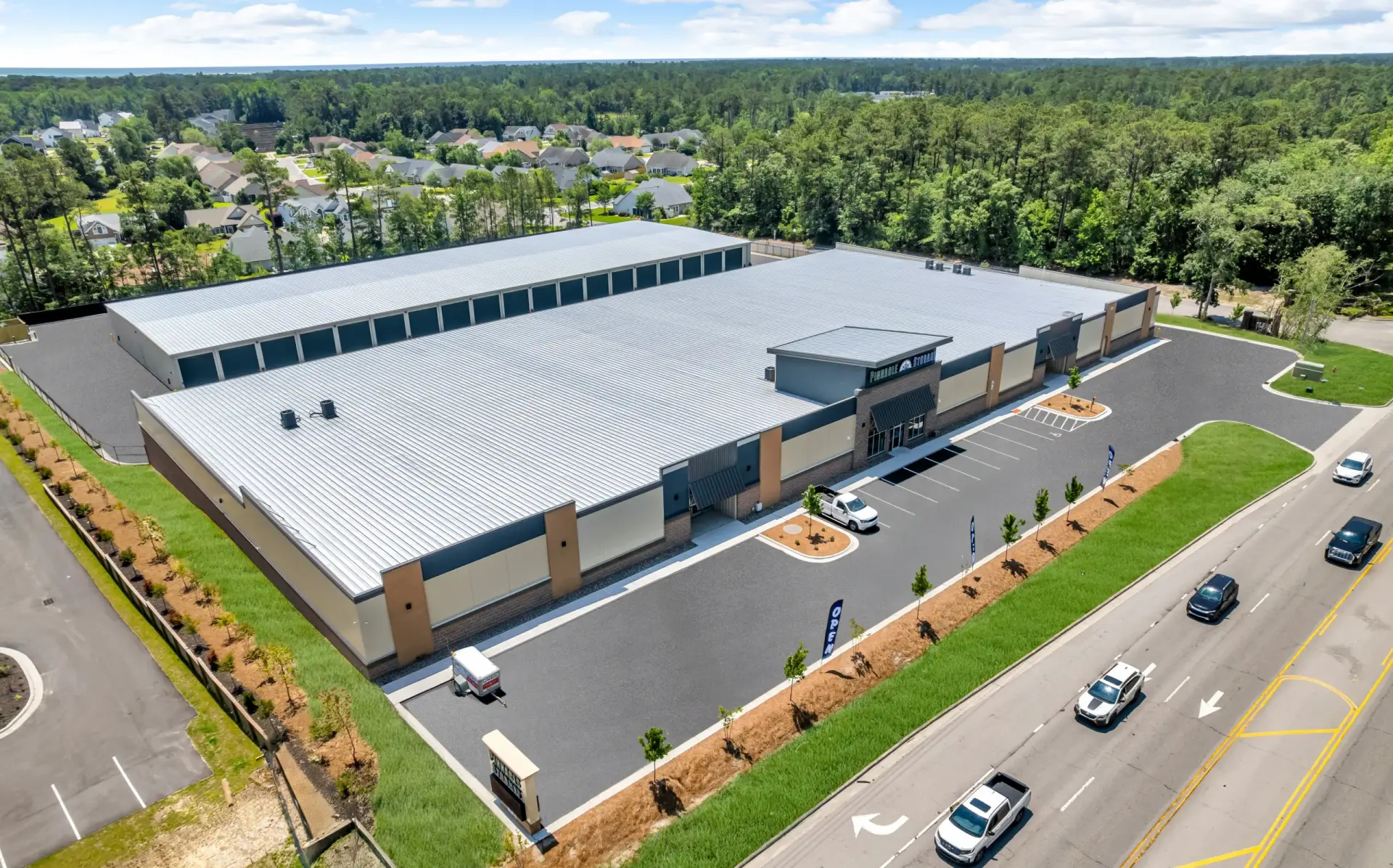 Large single-story storage facility with parking lot.